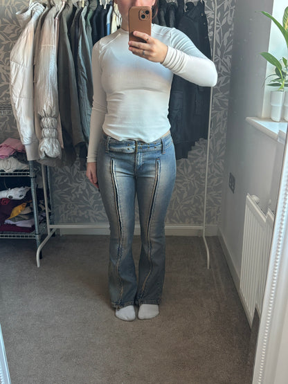 Denim flares with unique zip detail