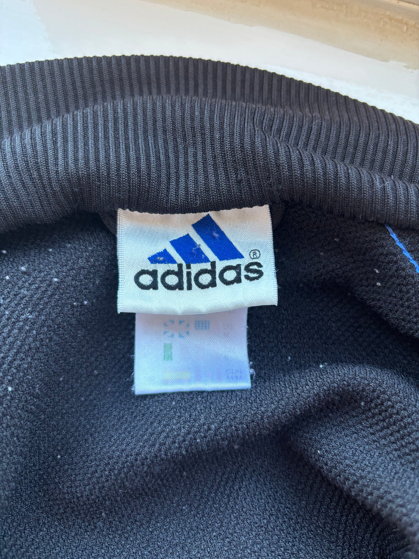 Black and blue Adidas track jacket