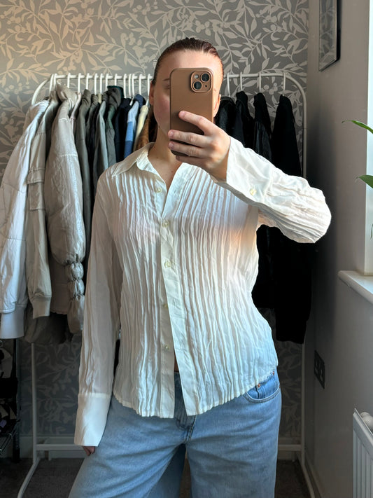 White blouse with crease detailing